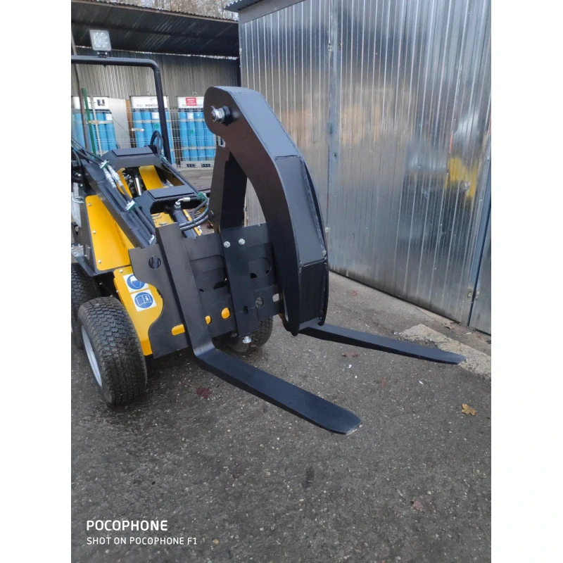 Paletové vidly s hydraulickým zubom na uchytenie materiálov